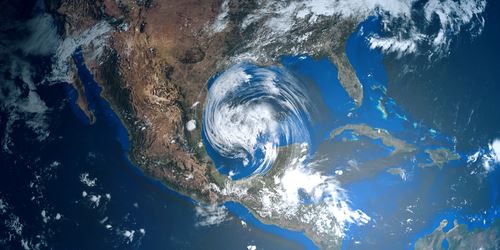 satellite image of earth with a hurricane near central america